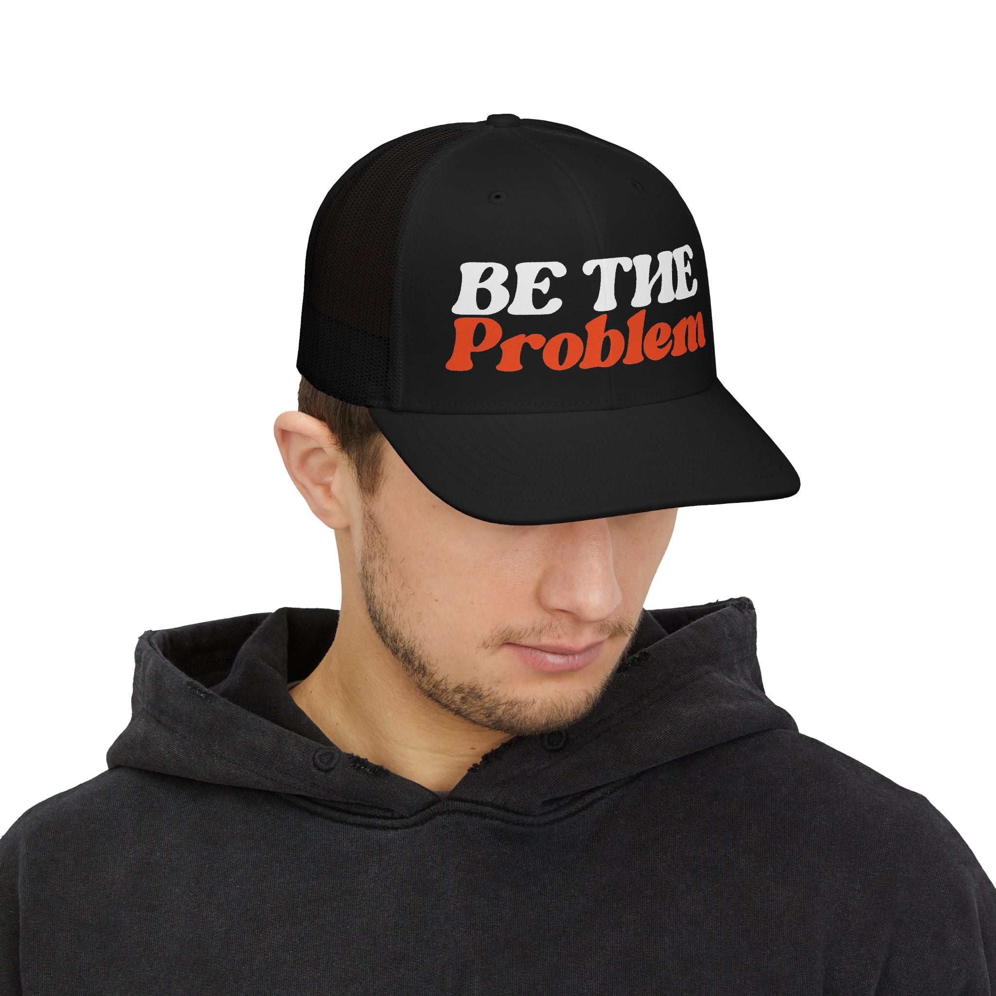 Be The Problem Trucker Cap